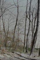 Looking down at long concrete pier from bluff